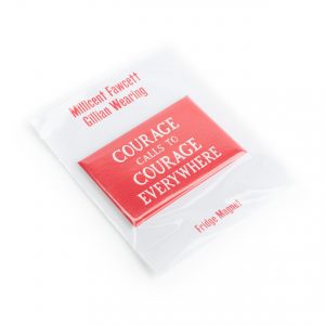 A red rectangle shaped magnet with the quote “Courage Calls” in the middle inside clear plastic packaging.