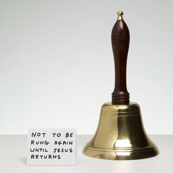 a brass bell with a small handwritten sign next to it that says 'not to be rung again until jesus returns'