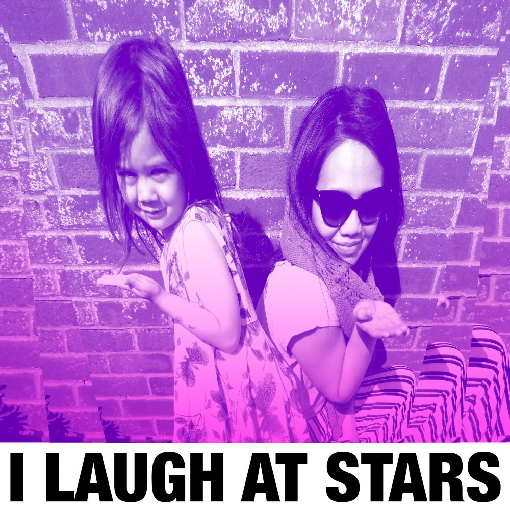 Two children standing back to back in front of a brick wall with a pink and purple filter.