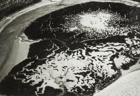 black and white aerial photograph of salt marsh in Essex