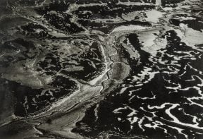 black and white aerial photograph of salt marsh in Essex