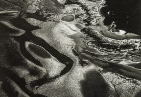 black and white aerial photograph of salt marsh in Essex