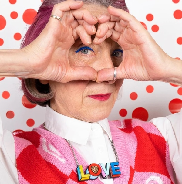 A model wears the Pop Love necklace by Tatty Devine