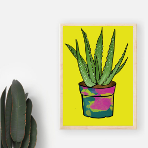 Framed Aloe Aloe Art Print set against a white wall. The illustration has a yellow background and a green aloe vera plant in a colourful plant pot.