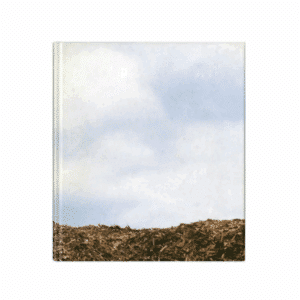 An image of the front of the book named 'Yeah.....You, Baby You' by Photographer Phil Collins. It shows a blue cloudy sky with a small strip of earth below.