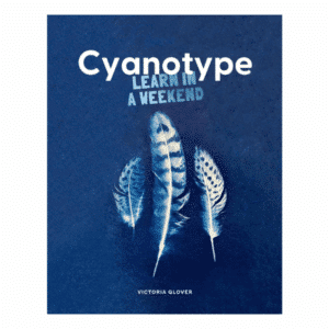 Front cover of the book 'Cyanotype: Learn in a Weekend by Victoria Glover' cover shows an examples of feathers printed via cyanotype.