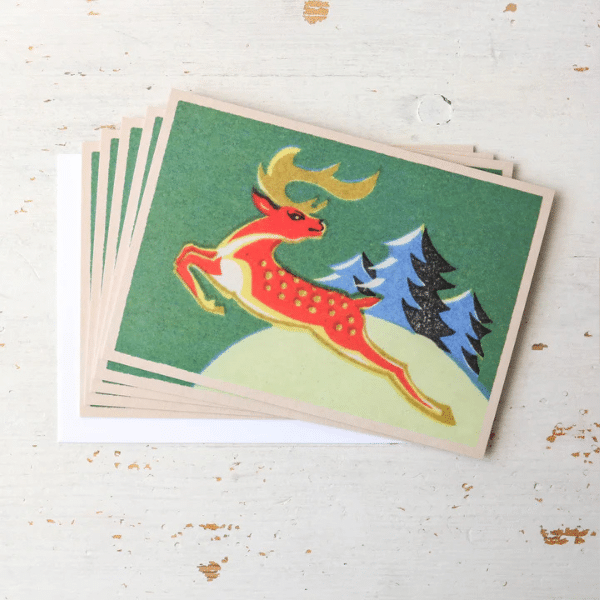 5 prancer vintage matchbox cards spread out on a table